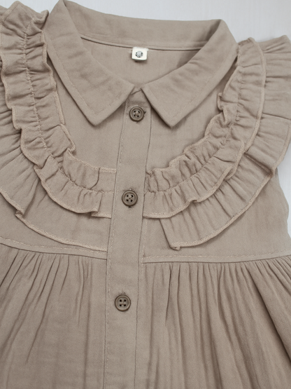 sleeveless beige ruffle dress