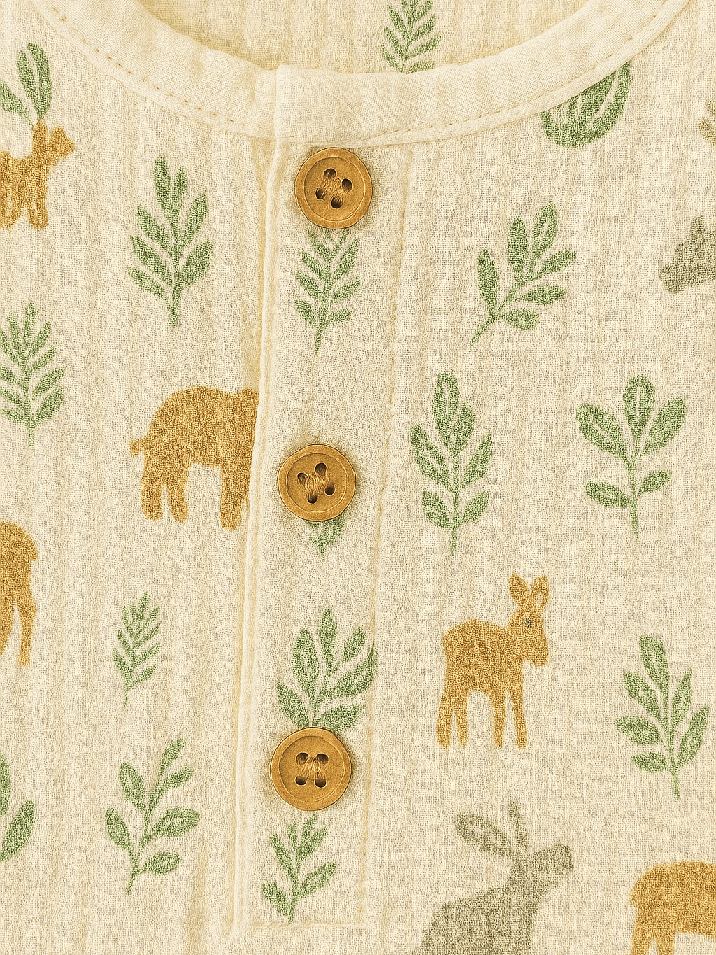 Close-up of fabric with animal and leaf pattern and buttons