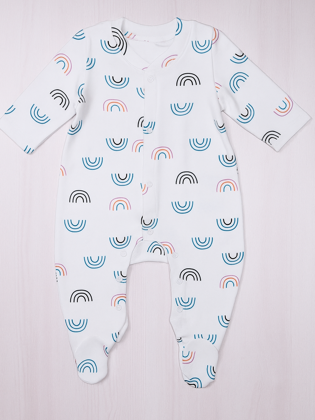Baby onesie with rainbow pattern