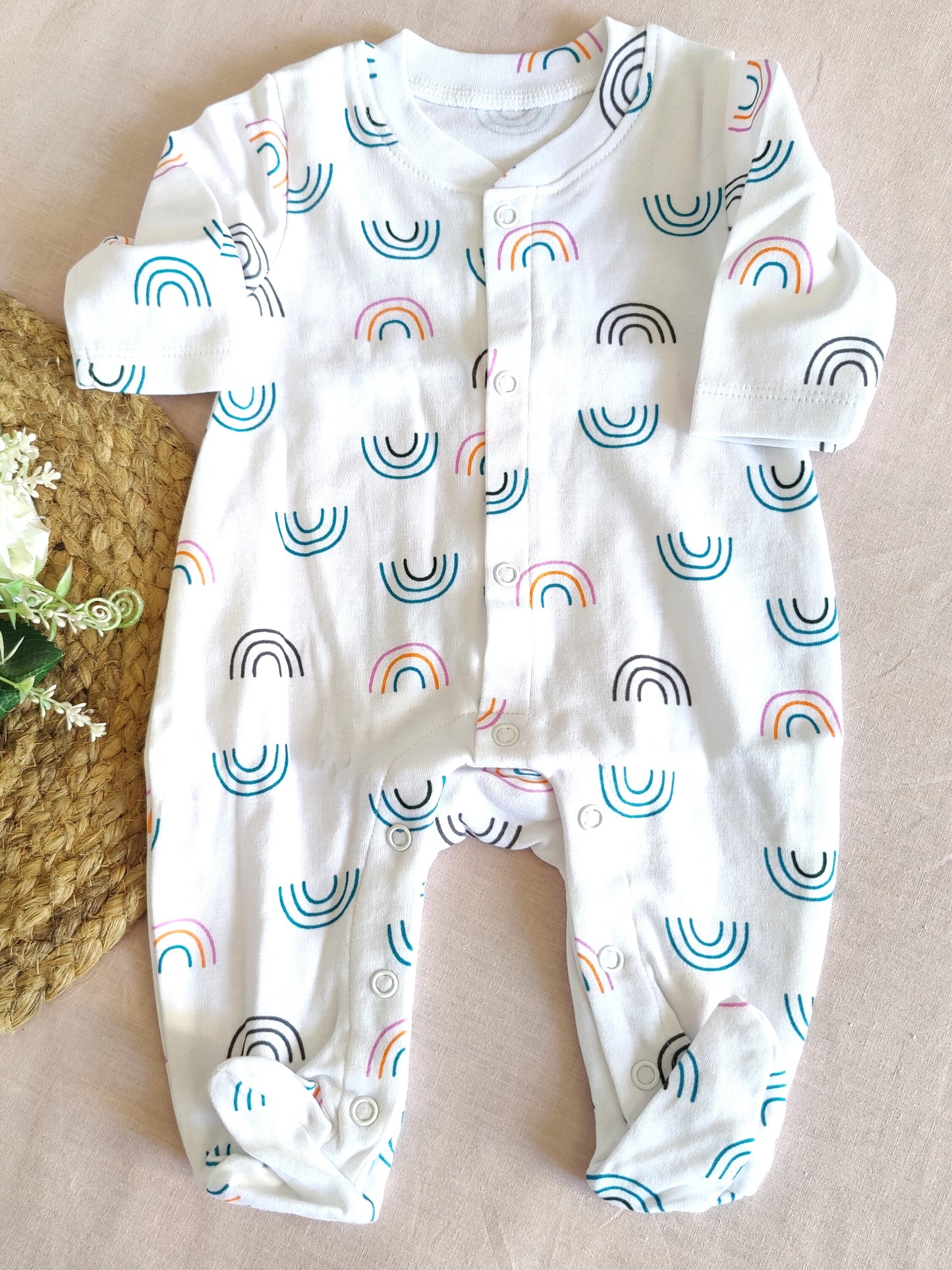 Baby bodysuit with rainbow pattern