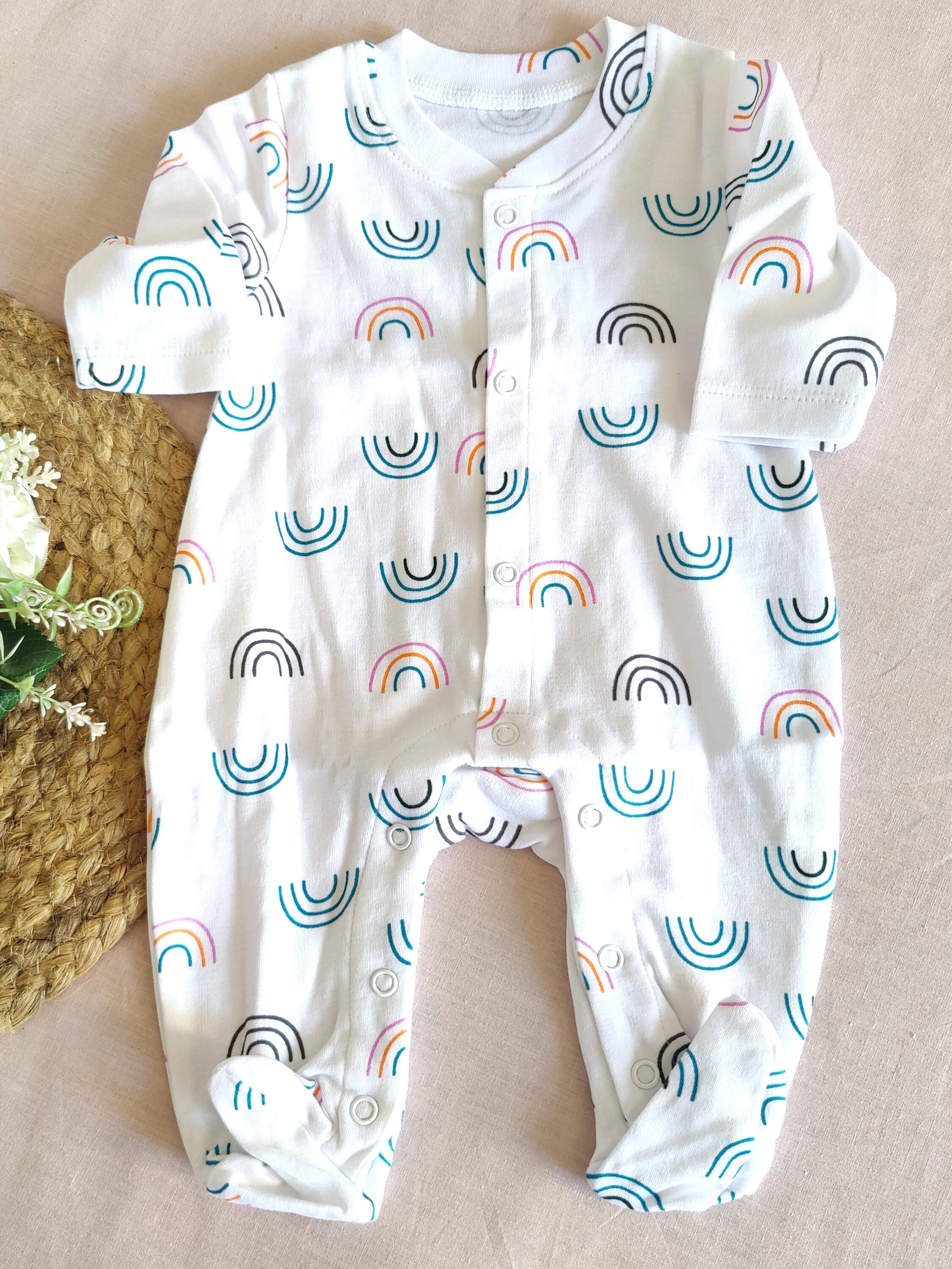 Baby bodysuit with rainbow pattern