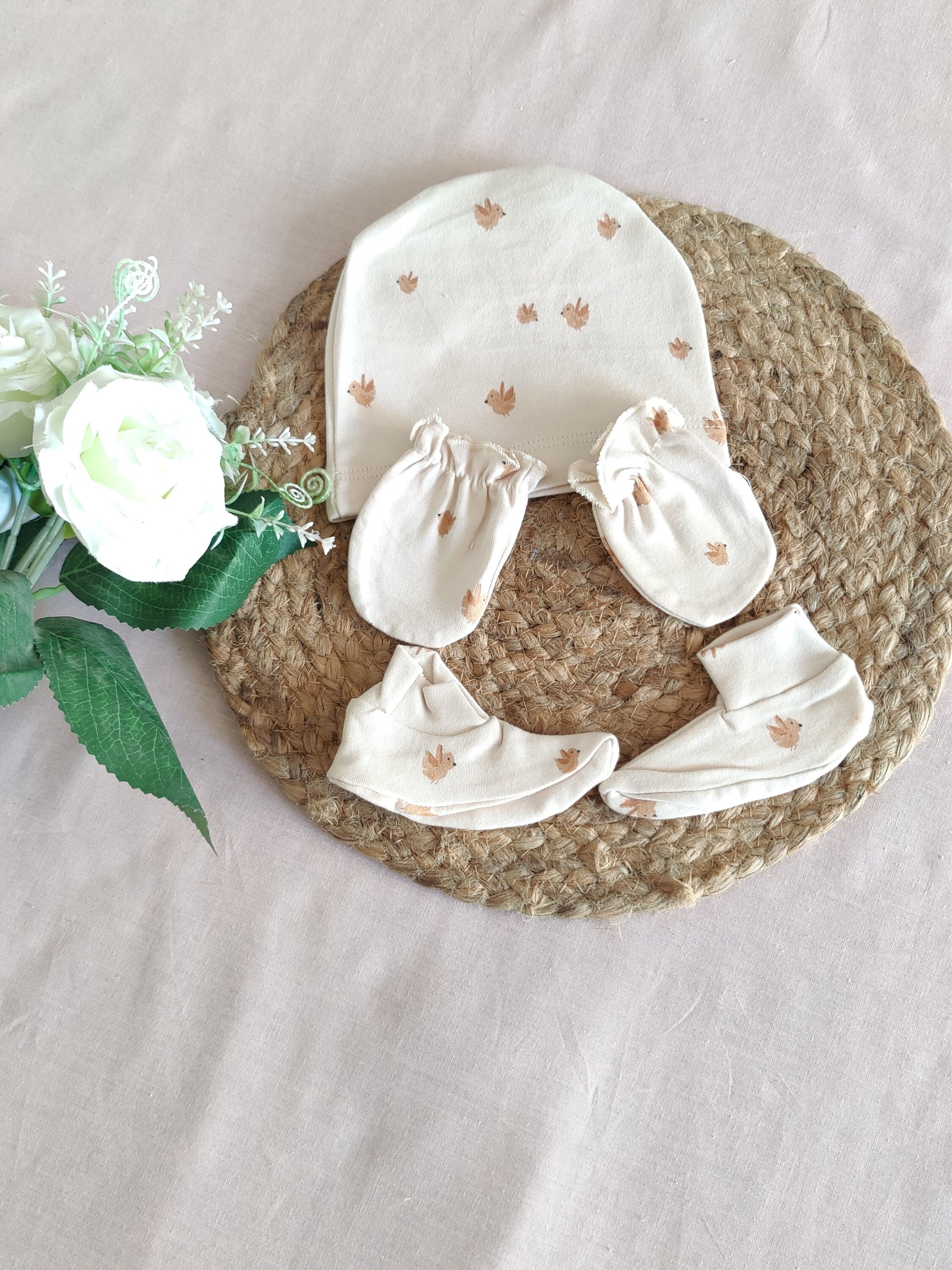 Baby clothing set with cap, booties, & mittens 