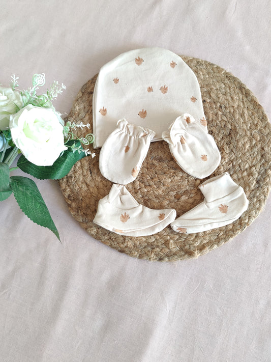 Baby clothing set with cap, booties, & mittens 