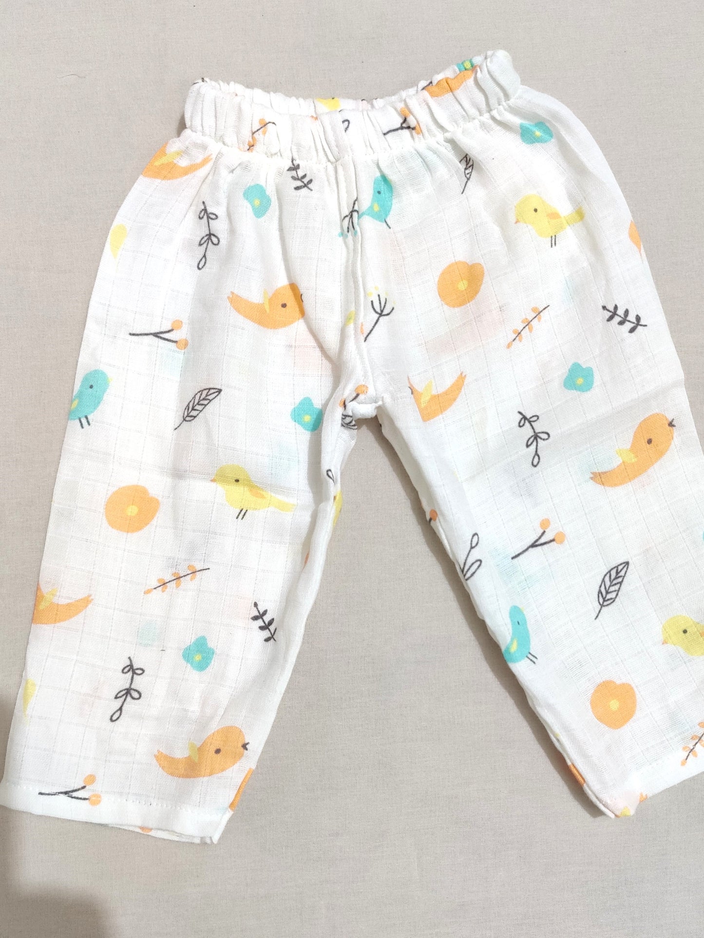 organic muslin children's pants with colorful bird pattern 