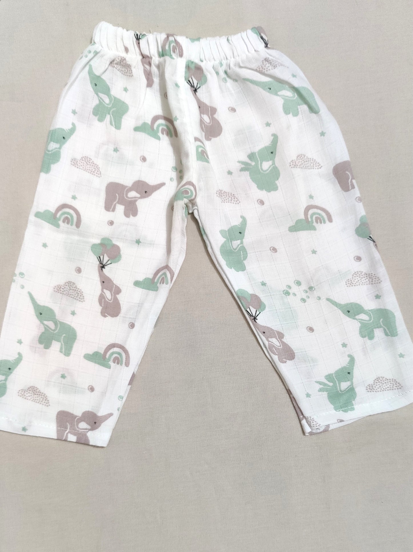Children's pants with elephant and rainbow pattern.