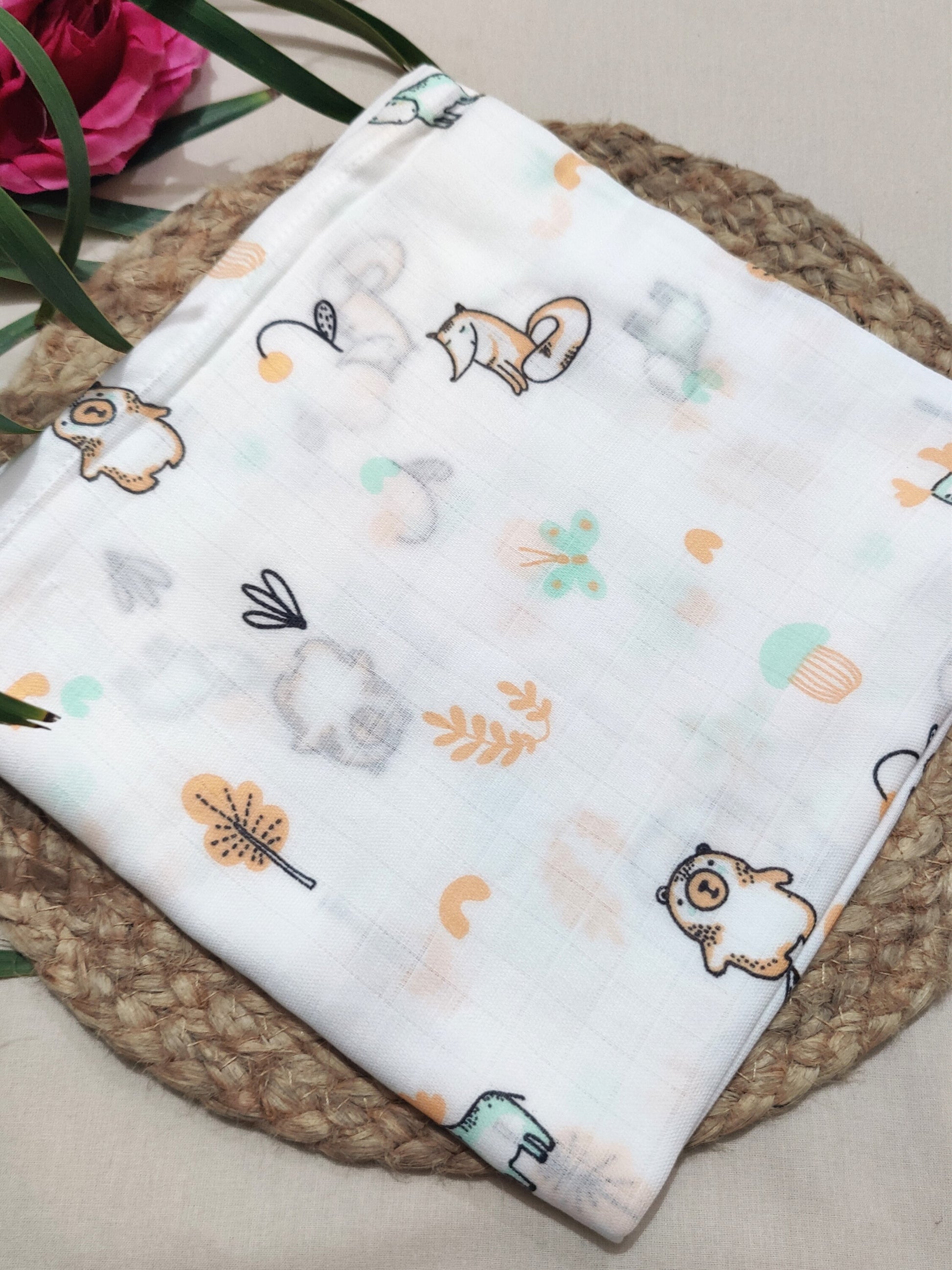 Animal print organic muslin swaddle
