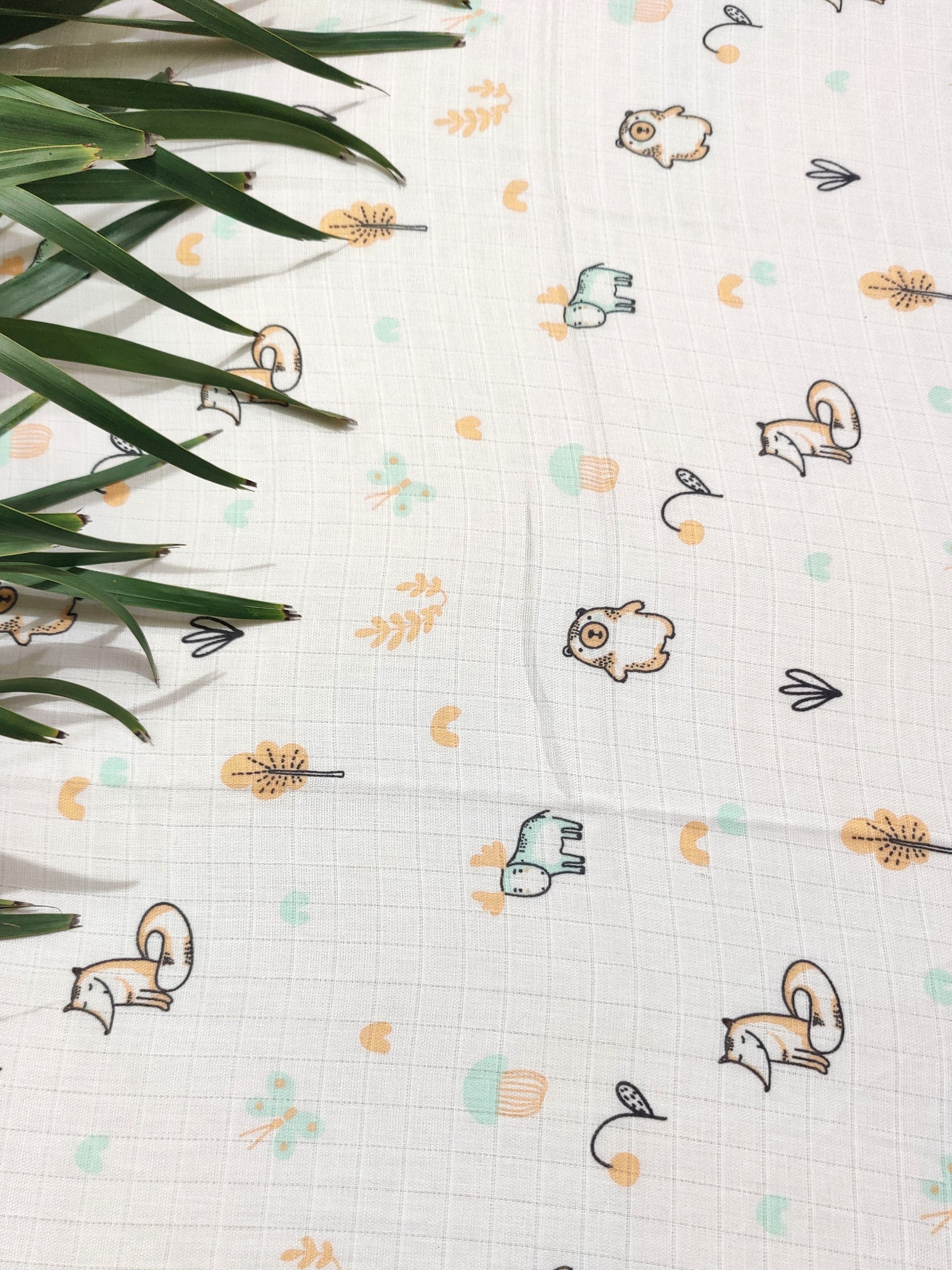 organic muslin swaddle with animal print